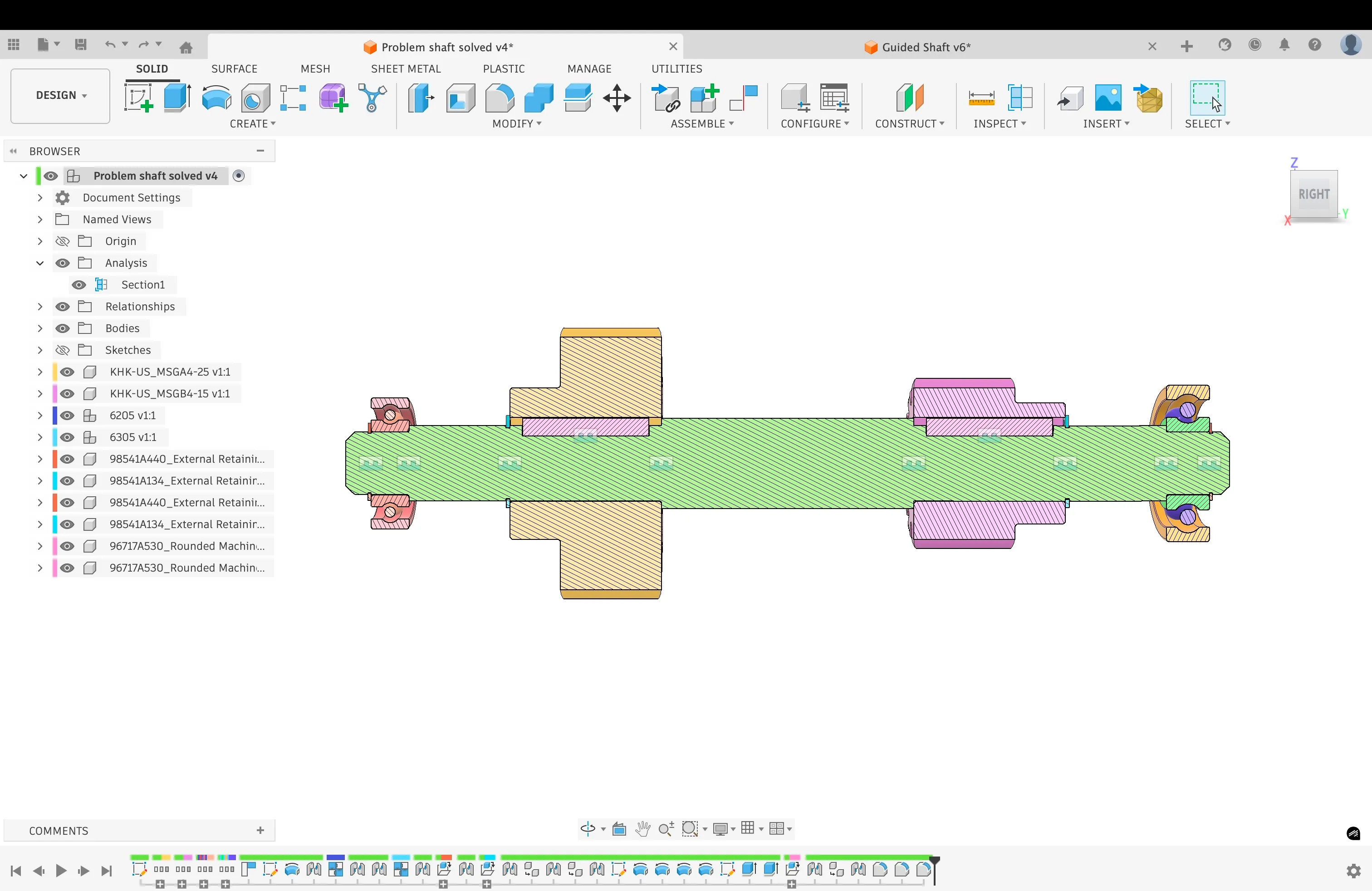 Side view of the assembled shaft with gears and bearing supports.