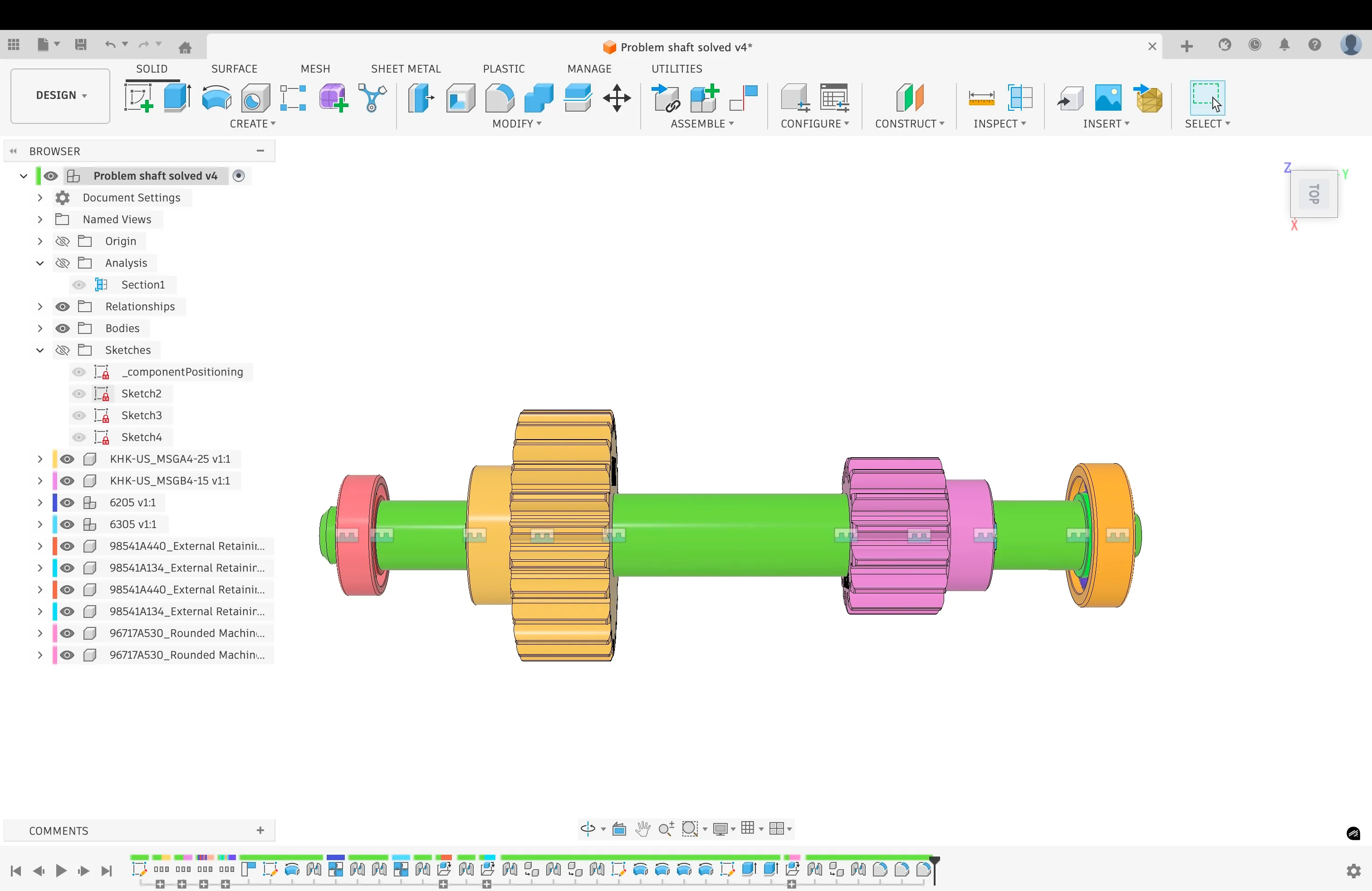 Close side view of the completed colored shaft assembly.